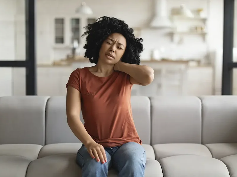 Physical therapist evaluating a patient with chronic pain