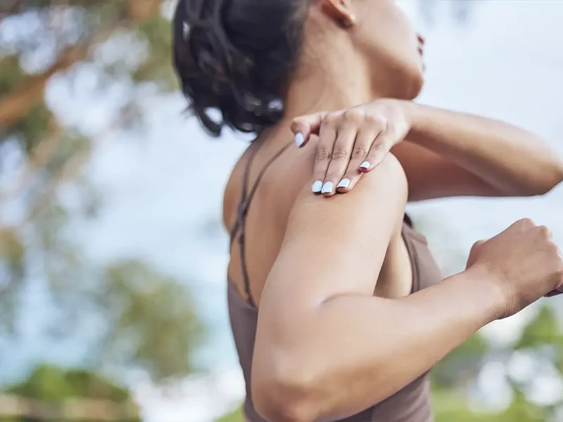 Physical therapist assessing a patient's joint movement and mobility