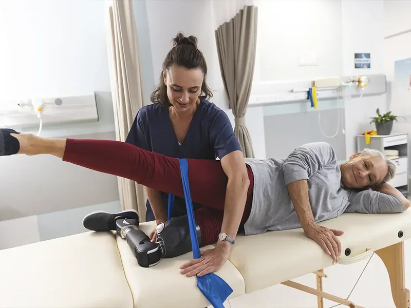 Physical therapist assessing a patient's joint and muscle movement