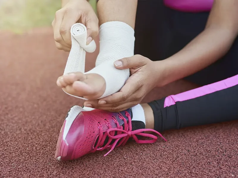 Physical therapist assessing an athlete's movement and mobility after a sports injury