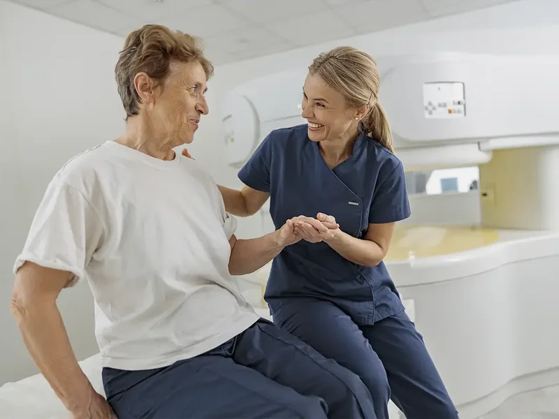 Physical therapist assessing a stroke patient's balance and mobility