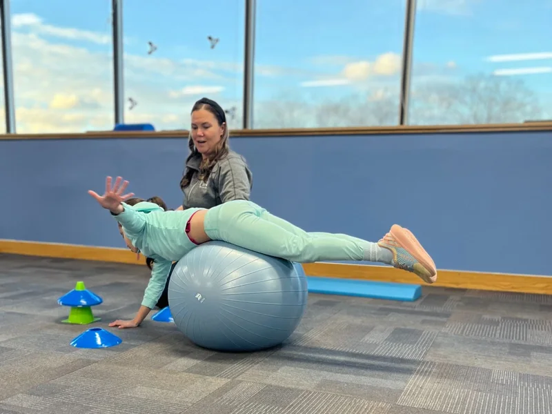 Patient working through guided mobility exercises with a therapist