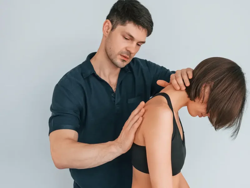 Clinician using Graston Technique instruments for soft tissue treatment