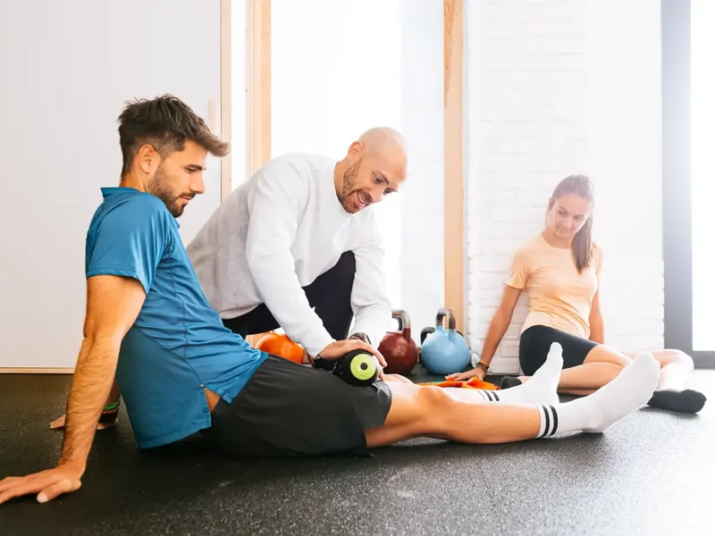 Doctor of Physical Therapy guiding an athlete through a return-to-sport strength test