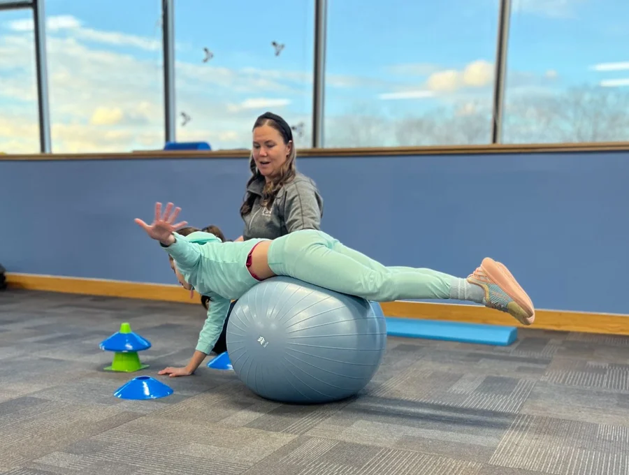 Physical therapist guiding a patient through a one-on-one session